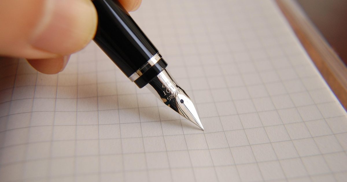 A fountain pen and a document on a desk, writing a cover letter in Morocco